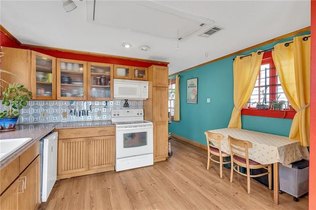 kitchen with white appliances, ornamental molding, light hardwood / wood-style floors, and backsplash