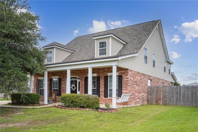 new england style home with a front lawn