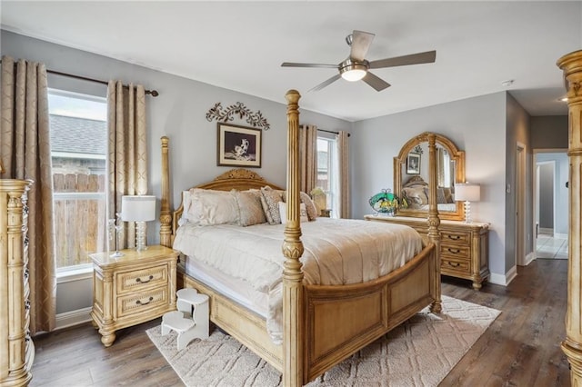 bedroom with ceiling fan and dark hardwood / wood-style flooring