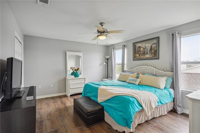 bedroom with dark wood-type flooring and ceiling fan