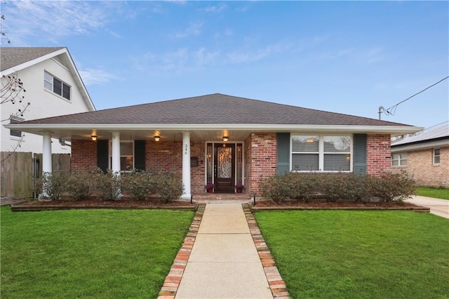 single story home featuring a front yard and covered porch