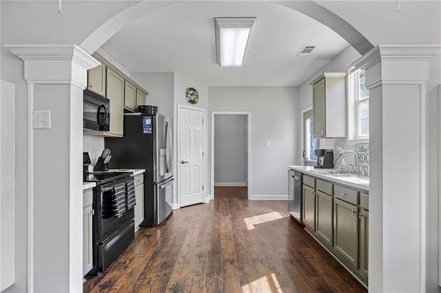 kitchen featuring dark wood-type flooring, sink, and black appliances