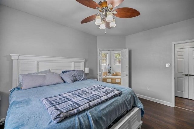 bedroom with dark hardwood / wood-style flooring, connected bathroom, and ceiling fan