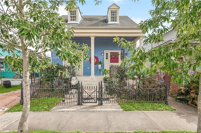 property entrance featuring a gate, fence, and a shingled roof