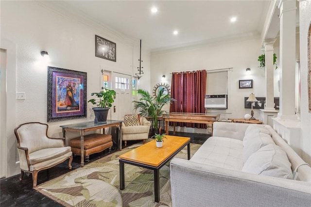 living area with recessed lighting, ornate columns, and ornamental molding