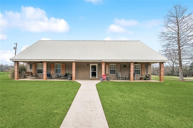 view of front of property with covered porch and a front yard