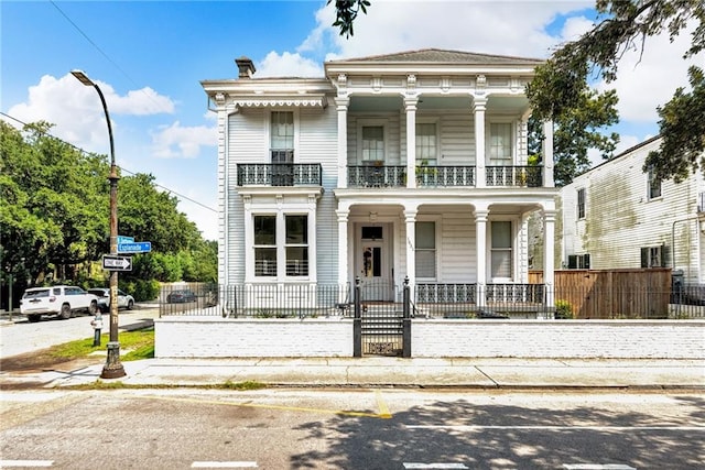 view of front of house featuring a balcony