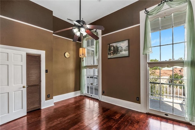 interior space with vaulted ceiling, dark hardwood / wood-style floors, and ceiling fan