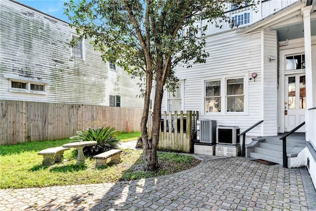 exterior space with a patio and cooling unit