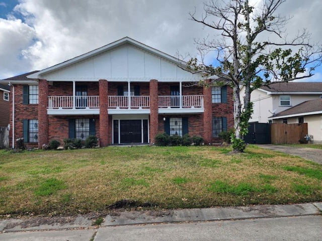 view of front of home with a balcony