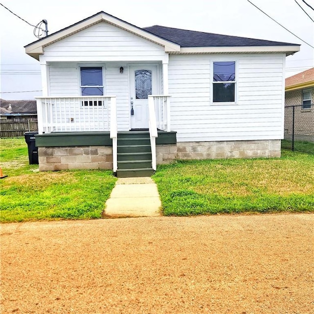 bungalow-style house featuring a front yard