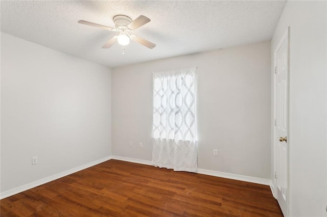 unfurnished room featuring ceiling fan, dark hardwood / wood-style floors, and a textured ceiling