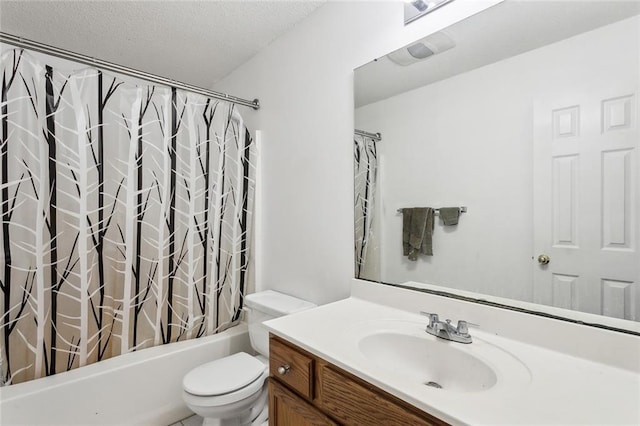 full bathroom featuring vanity, a textured ceiling, toilet, and shower / tub combo with curtain