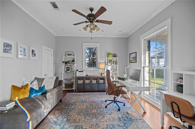 home office featuring crown molding, ceiling fan, and wood-type flooring