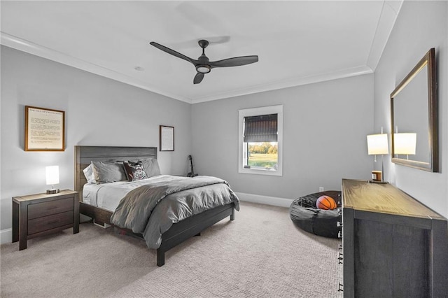 bedroom featuring crown molding, light colored carpet, and ceiling fan