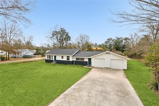 ranch-style house with a garage and a front yard