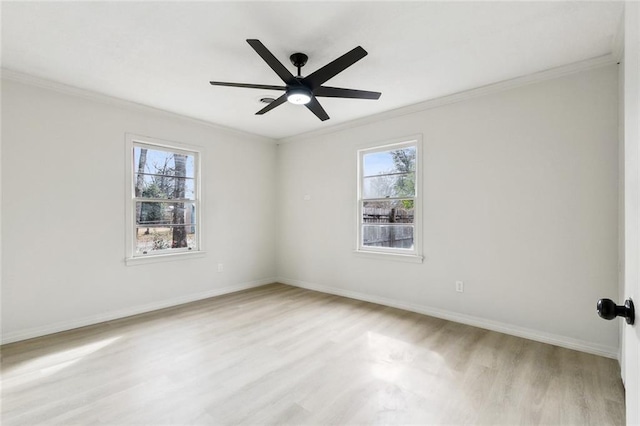 empty room featuring crown molding, light hardwood / wood-style floors, and ceiling fan