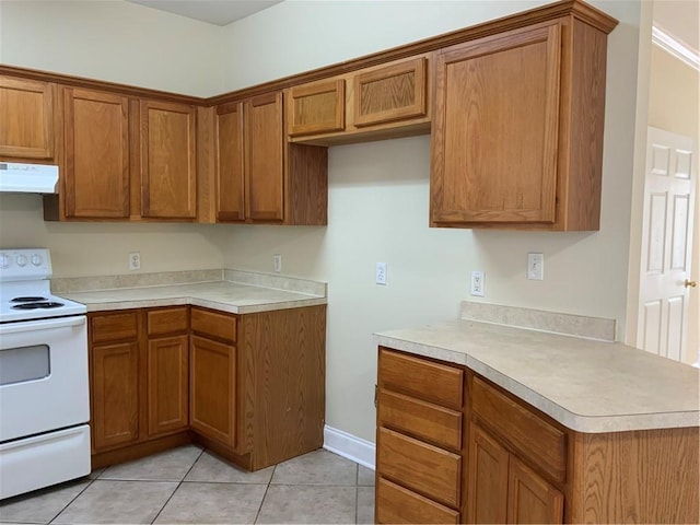 kitchen with light tile patterned flooring and white range with electric stovetop