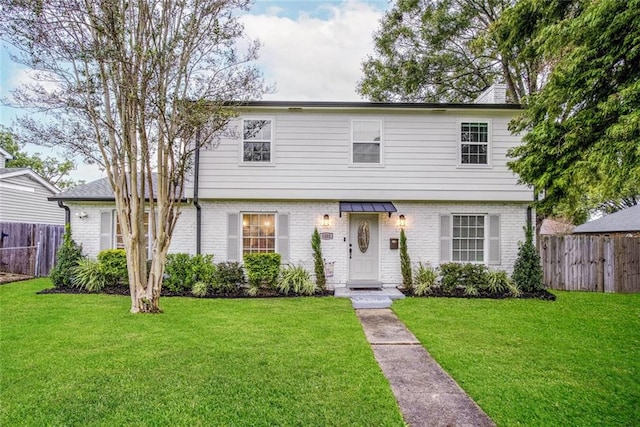 view of front of house with a front lawn