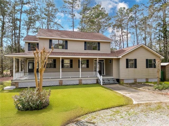 farmhouse-style home with covered porch and a front lawn