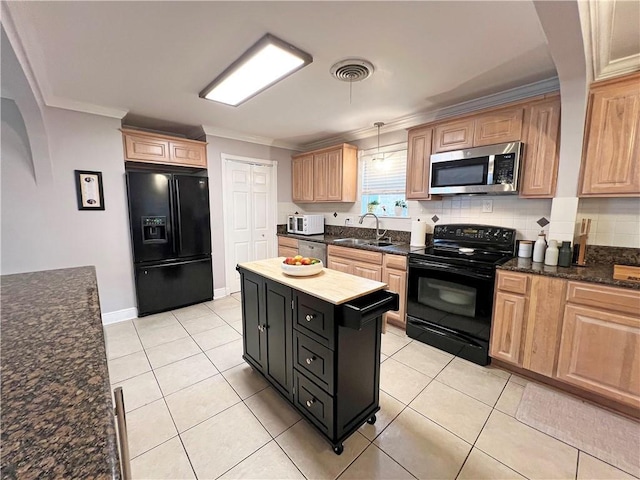 kitchen featuring pendant lighting, tasteful backsplash, sink, ornamental molding, and black appliances