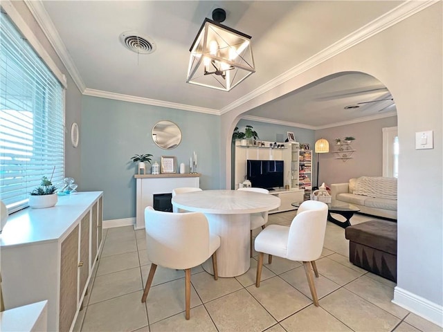 tiled dining space with crown molding