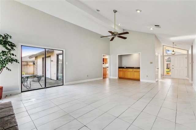 unfurnished living room featuring light tile patterned floors, visible vents, a ceiling fan, high vaulted ceiling, and baseboards