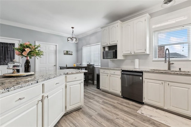 kitchen with sink, crown molding, hanging light fixtures, black dishwasher, and white cabinets