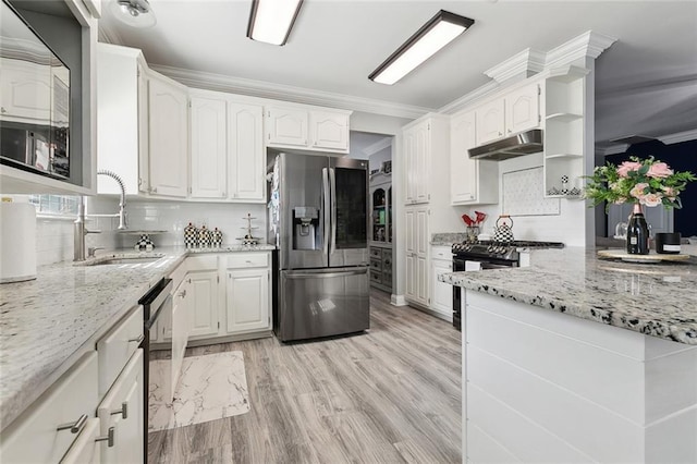 kitchen with stainless steel appliances, light stone countertops, sink, and white cabinets