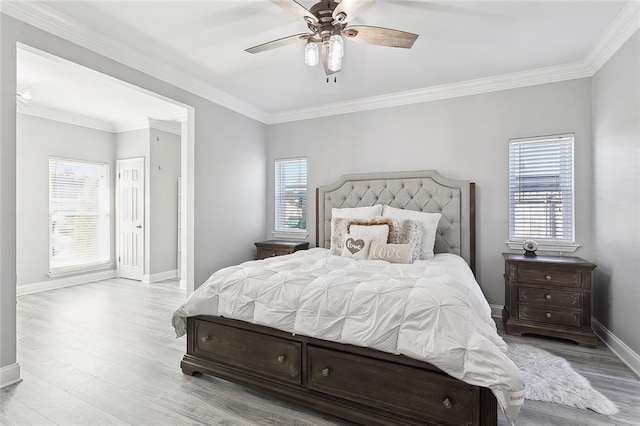 1125 Kingswood Dr, Westwego, LA 70094 - bedroom featuring a ceiling fan, wood finished floors, baseboards, and ornamental molding