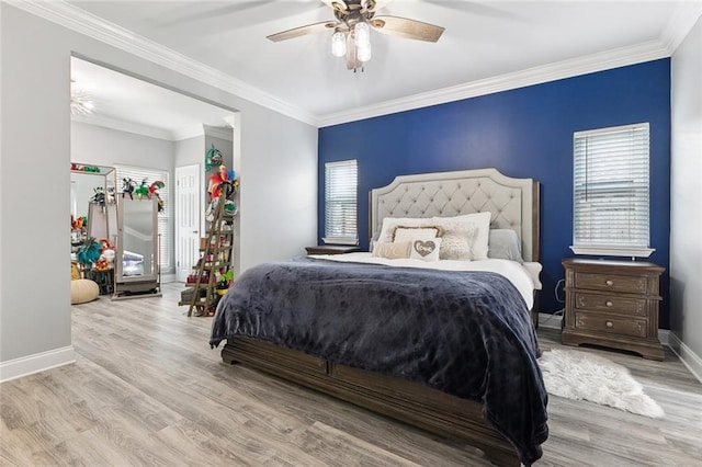 bedroom featuring crown molding and light wood-type flooring