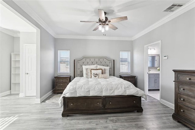 1125 Kingswood Dr, Westwego, LA 70094 - bedroom with ornamental molding, visible vents, baseboards, and wood finished floors