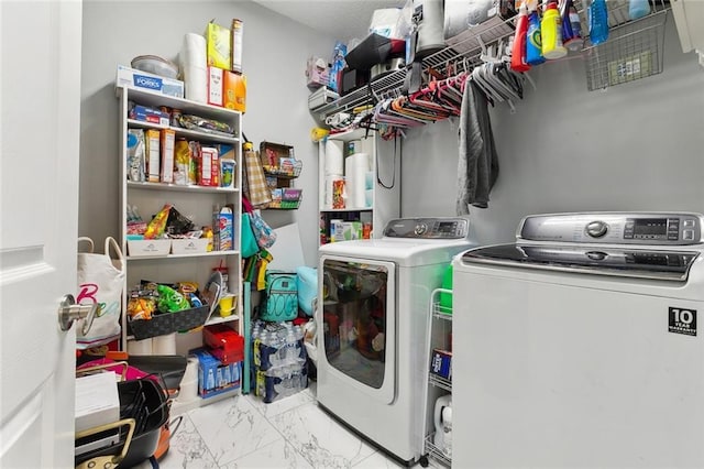 laundry room with independent washer and dryer