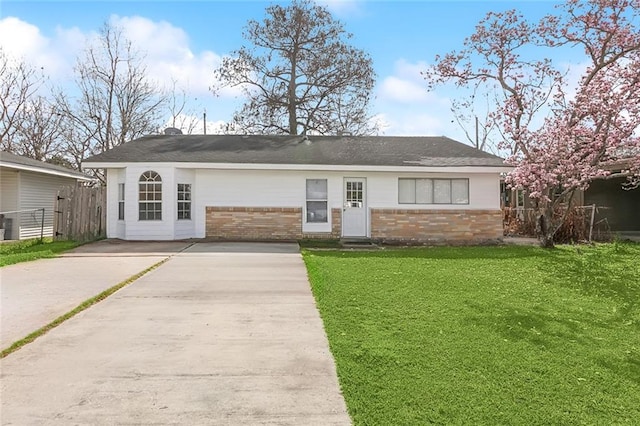 ranch-style house with a front lawn