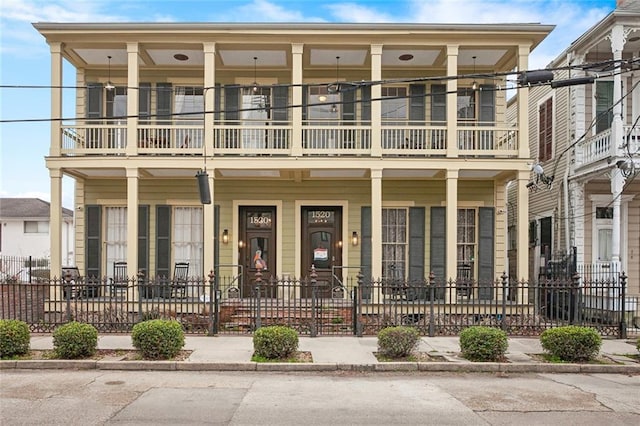 view of front of property with a balcony