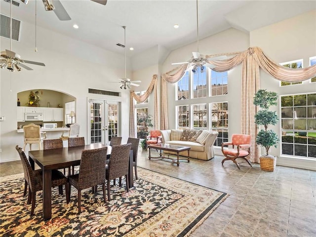 dining room with visible vents, french doors, high vaulted ceiling, and ceiling fan