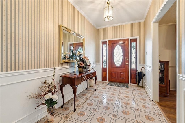 entrance foyer featuring crown molding