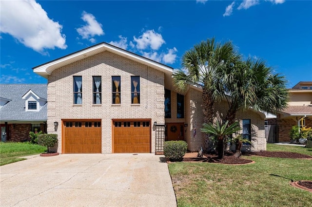 view of front of home featuring a garage and a front yard