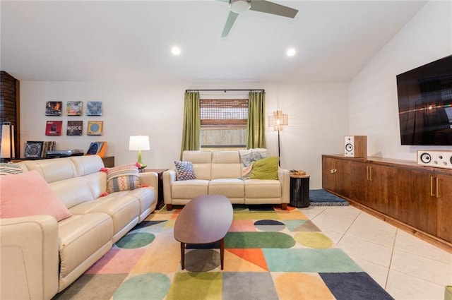 tiled living room with lofted ceiling and ceiling fan