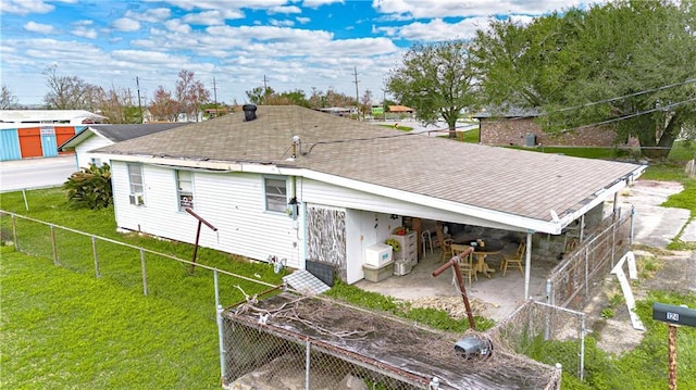 rear view of house with a lawn