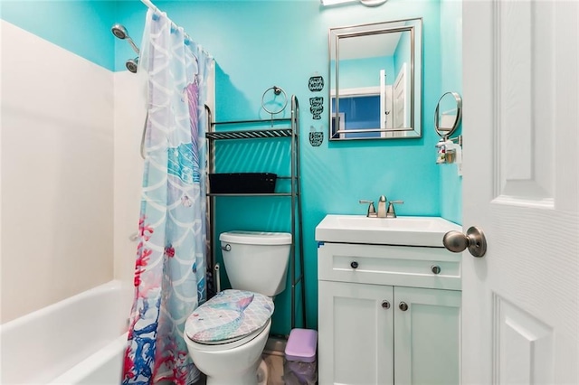 full bath with toilet, shower / bathtub combination with curtain, and vanity