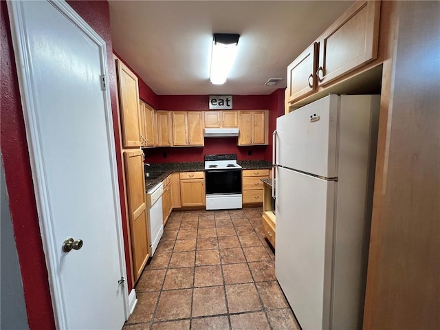 kitchen with sink, light brown cabinetry, and white appliances