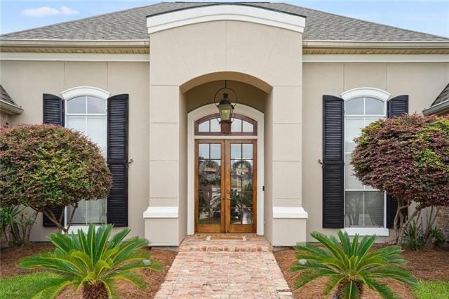 property entrance featuring french doors