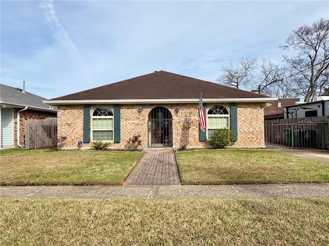 ranch-style house with a front yard