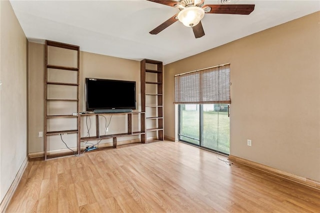 unfurnished living room featuring ceiling fan and light hardwood / wood-style floors