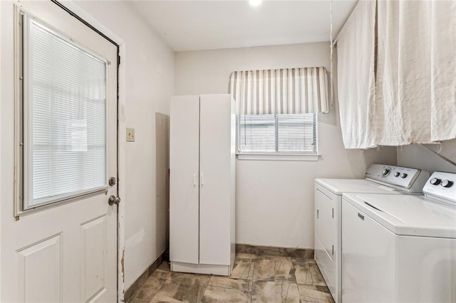 clothes washing area featuring washer and clothes dryer