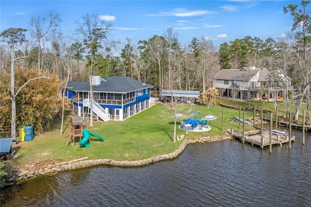 birds eye view of property with a water view