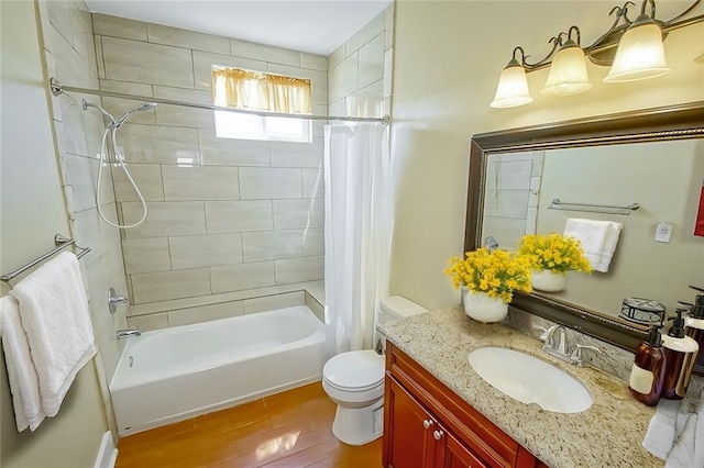 full bathroom with shower / tub combo, vanity, toilet, and hardwood / wood-style floors