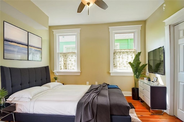 bedroom featuring ceiling fan and light wood-type flooring