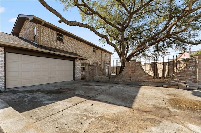 view of side of property featuring a garage